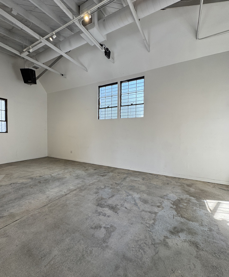 Open studio floor with high ceilings and natural light